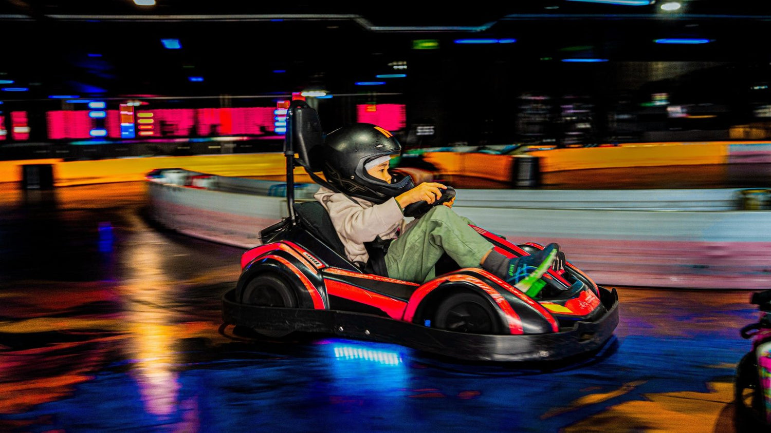 A small child in a kids kart on the Hyper Karting mini track